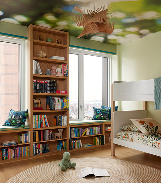 Built In Walnut Wall Length Shelves in a Colorful Green Contemporary Kids Bedroom